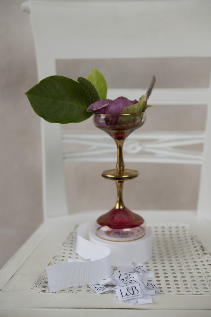 champagne coupes holding flower